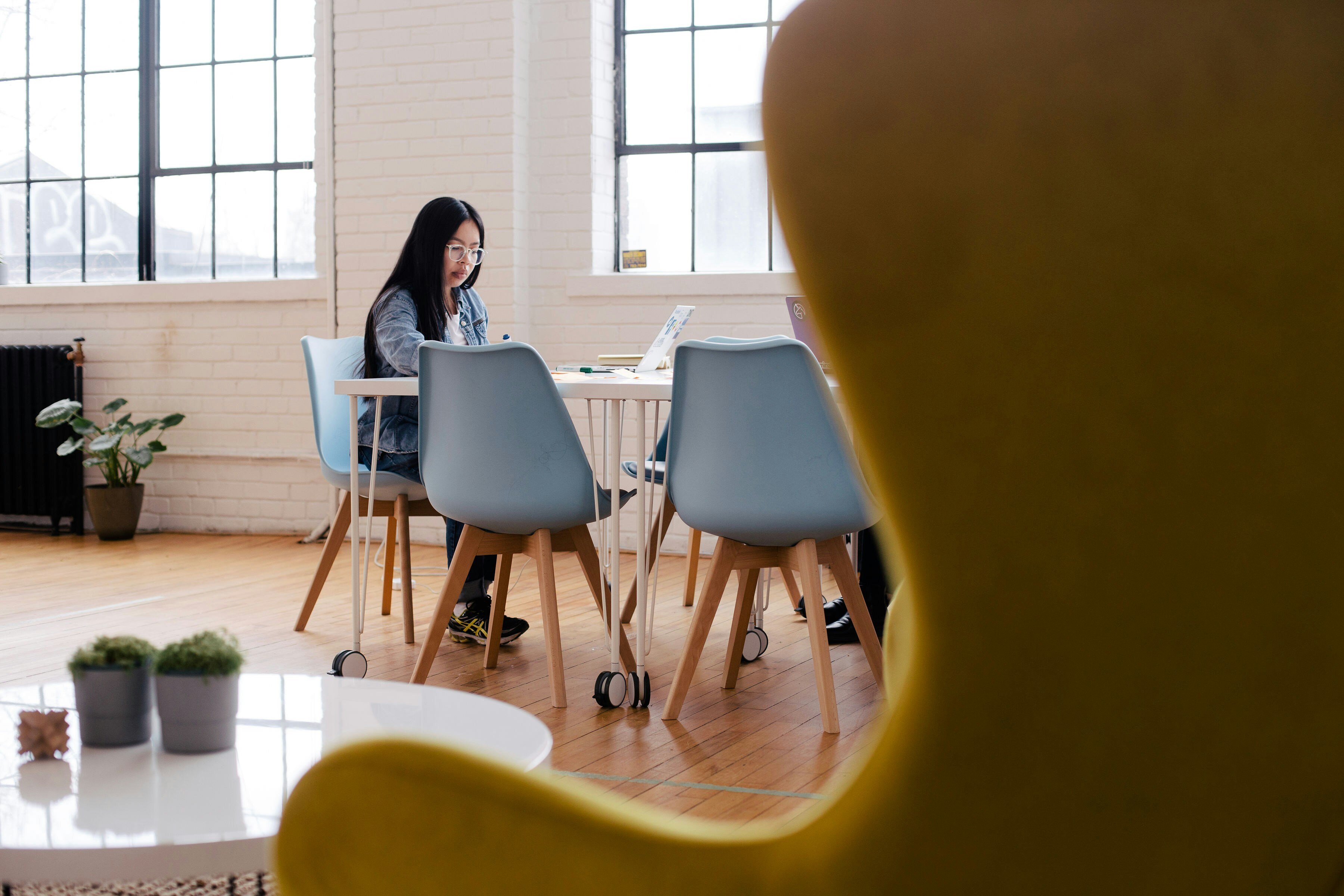 A photographer organizing client details and appointments using a CRM system, illustrating the efficiency and organization provided by CRM to start a photography business